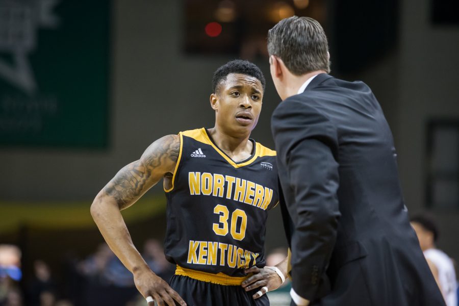 Lavone Holland II (30) talks to Head Coach John Brannen during a timeout in the game against Wright State .