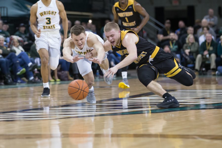 Tyler Sharpe (15) dives for a loose ball in the game against Wright State.