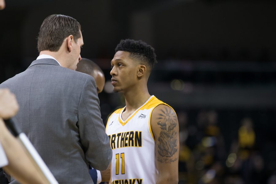 Head Coach John Brannen talks to Mason Faulkner (11) during the game against Youngstown State.