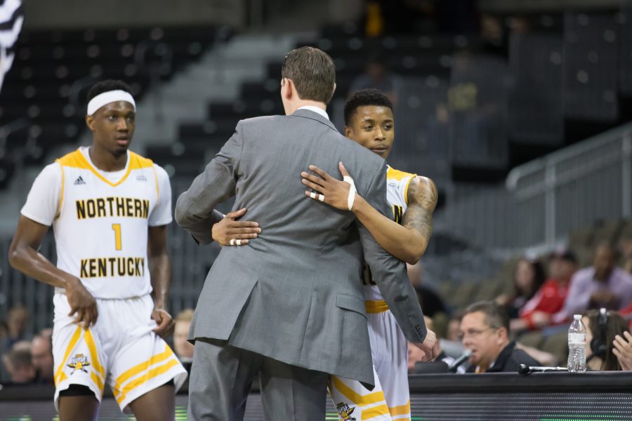 Head Coach John Brannen congratulates Lavone Holland II (30) as he comes out of his final home match.