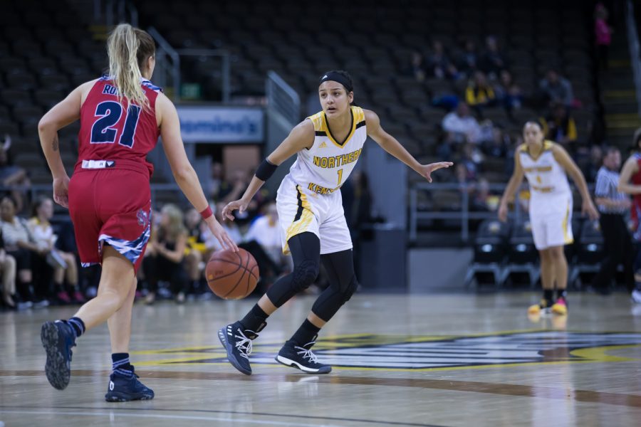 Grace White (1) guards a Detroit Mercy player.