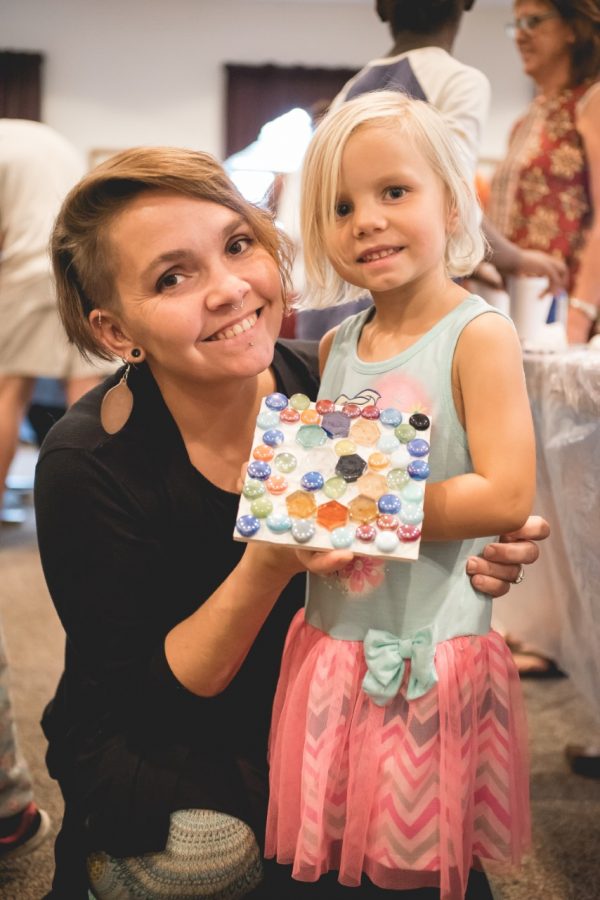 Rust-Jordan and her daughter, Stella, at a mosaic workshop she held for mothers to craft with their children with kindergarten readiness. 