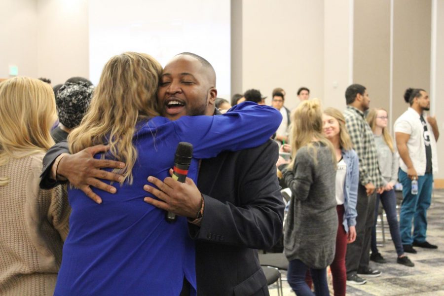 Nick Jackson hugs an attendee at NKUnity in the Student Union.