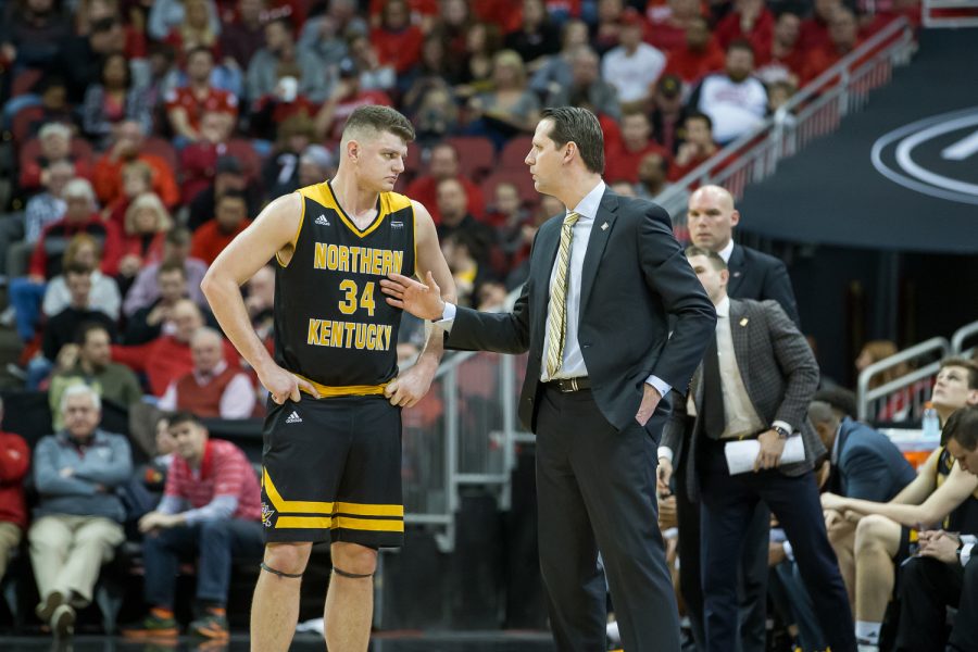 Drew McDonald (34) talks to Head Coach John Brannen during a free throw during the game against Louisville.