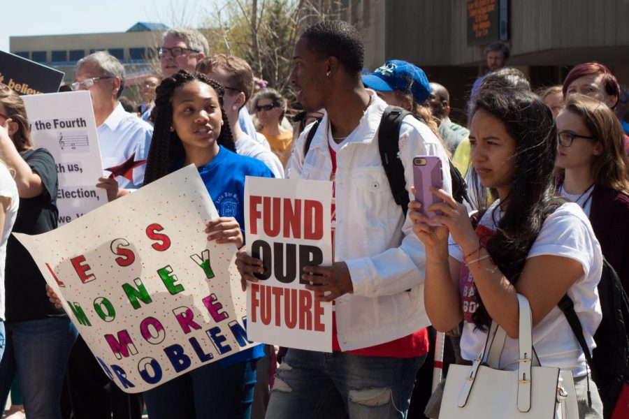 Signs included "FUND OUR FUTURE" and "SUPPORT PUBLIC EDUCATION." 