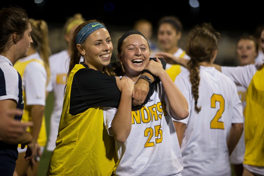 Payton Naylor (25) is embraced by teammate Emily Soltes (7) after scoring the winning goal in the 1-0 victory over Xavier.