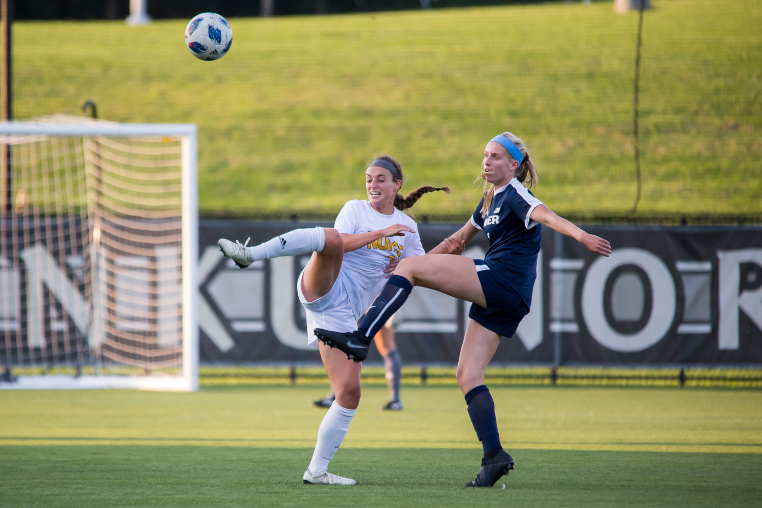 Erin Sutton (2) reaches to get a touch on a high ball. – The Northerner