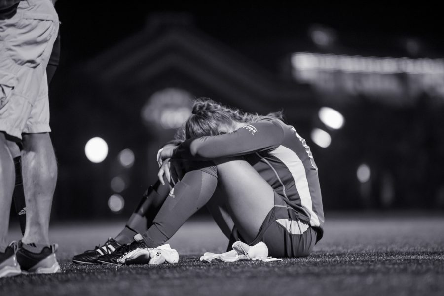 Keeper Emily Lohmann (00) reacts after letting in a goal during overtime in the game against UC.