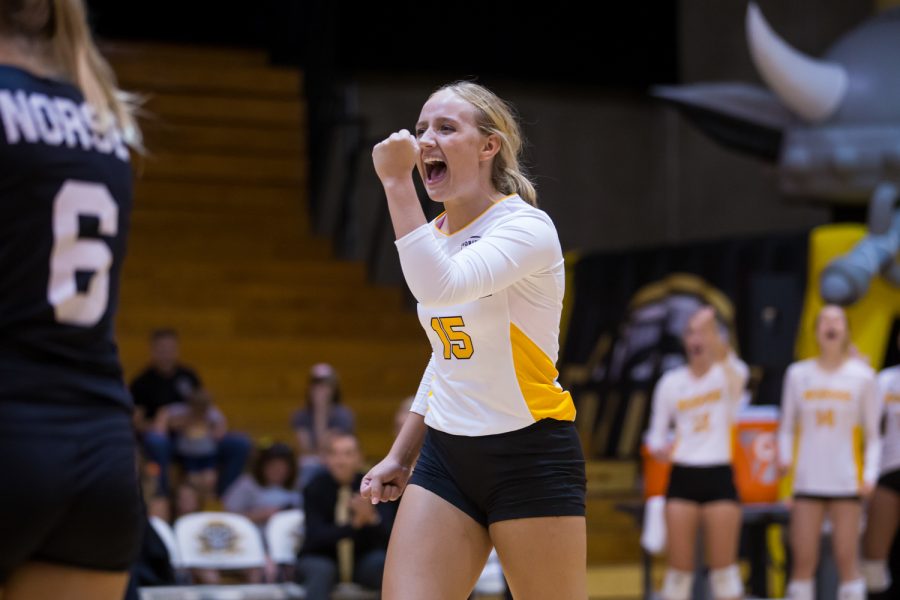 Maddy Weber (15) celebrates after the Norse score a point during the contest against Green Bay.