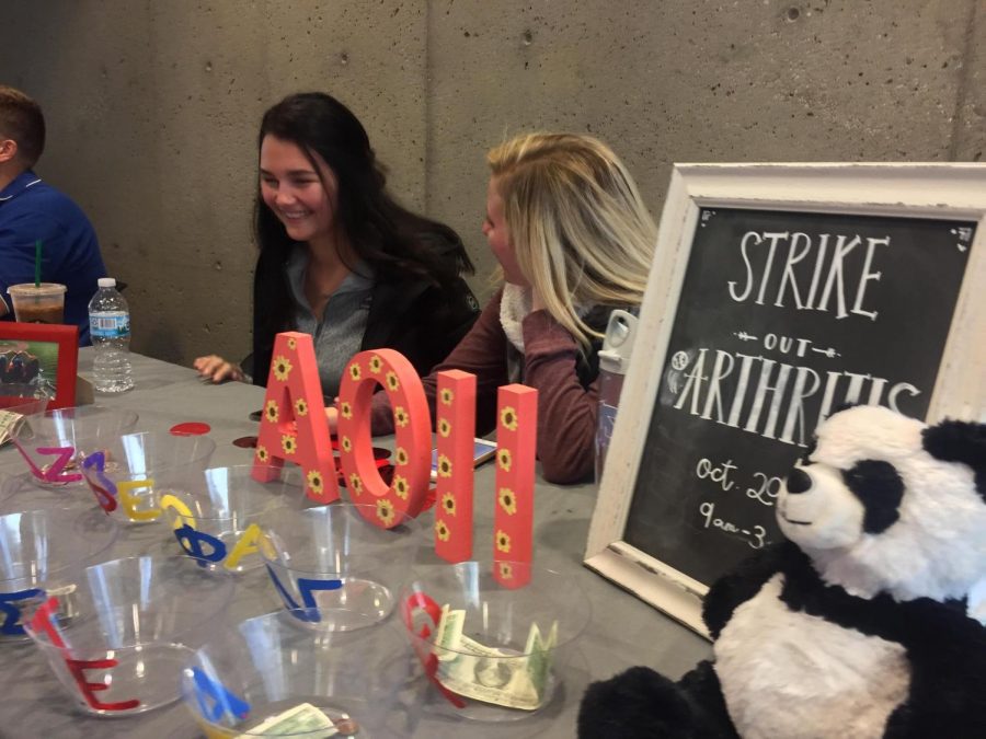 AOII tabling in the SU today for their Strike Out for Arthritis tournament.