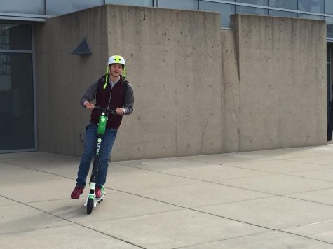 Freshman Tim Dahleh rides a scooter as part of demo day back in October.