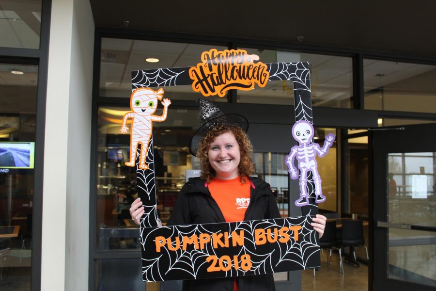 Sophomore Korbin Florer, sports business and finance double major, becomes wickedly cool as she helps with Activites Programming Board's Pumpkin Bust on Oct. 31, 2018.