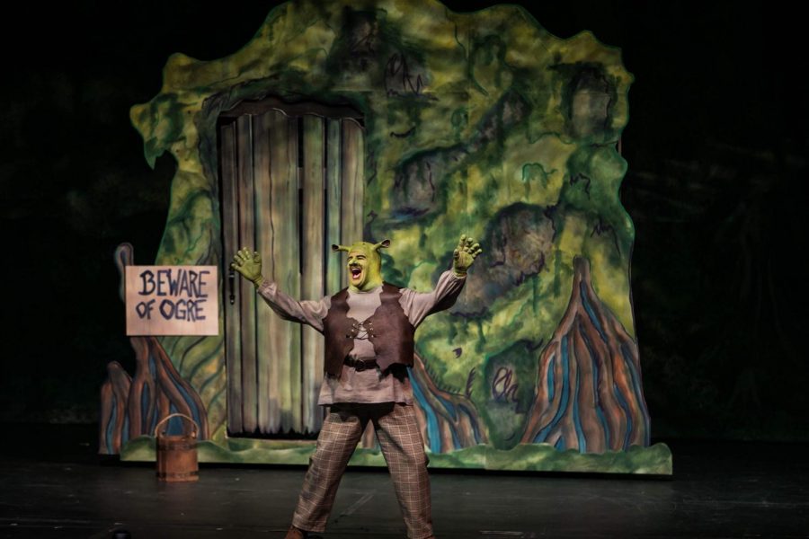 Newton in Shrek performing 