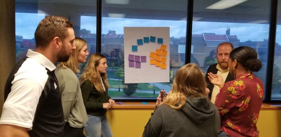 Center for Innovation students discuss customer segments and the best course of action to take. 
