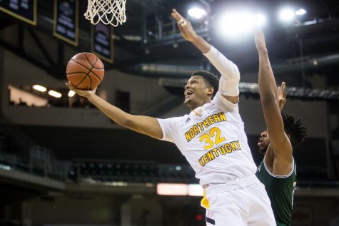 Dantez Walton (32) goes up for a shot during the game against Manhattan. Walton had 15 points on the game.