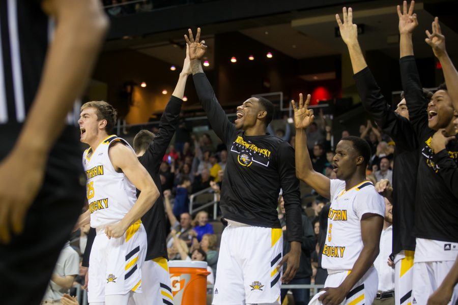 NKU players celebrate after a three point shot by Tyler Sharpe (15).