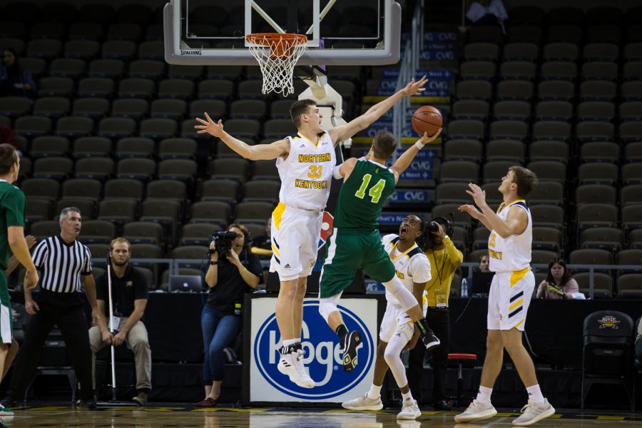 Chris Vogt (33) blocks a shot by a Wilmington player. Vogt had 3 blocks on the game.