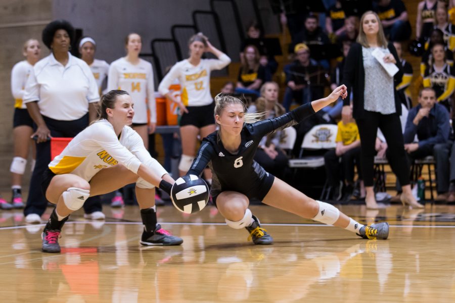 Haley Libs (4) and Ashton Terrill (6) fight to save a ball during the game against Oakland.