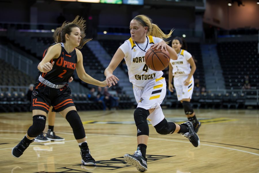 Taylor Clos (4) drives toward the basket during the game against University of Pikeville.