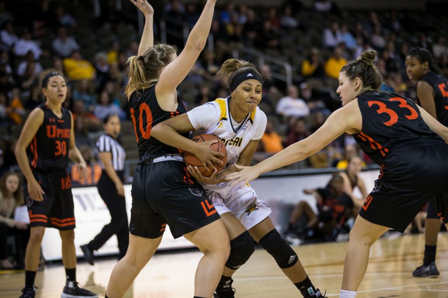Samari Mowbray (5) fights to shoot during the game against University of Pikeville.