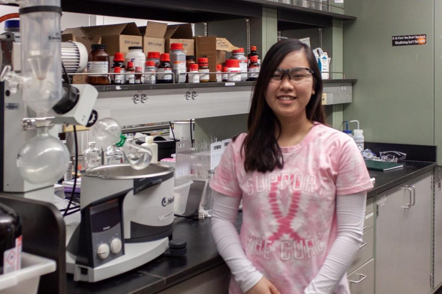 Quynh Nguyen works in a lab inside the science center.
