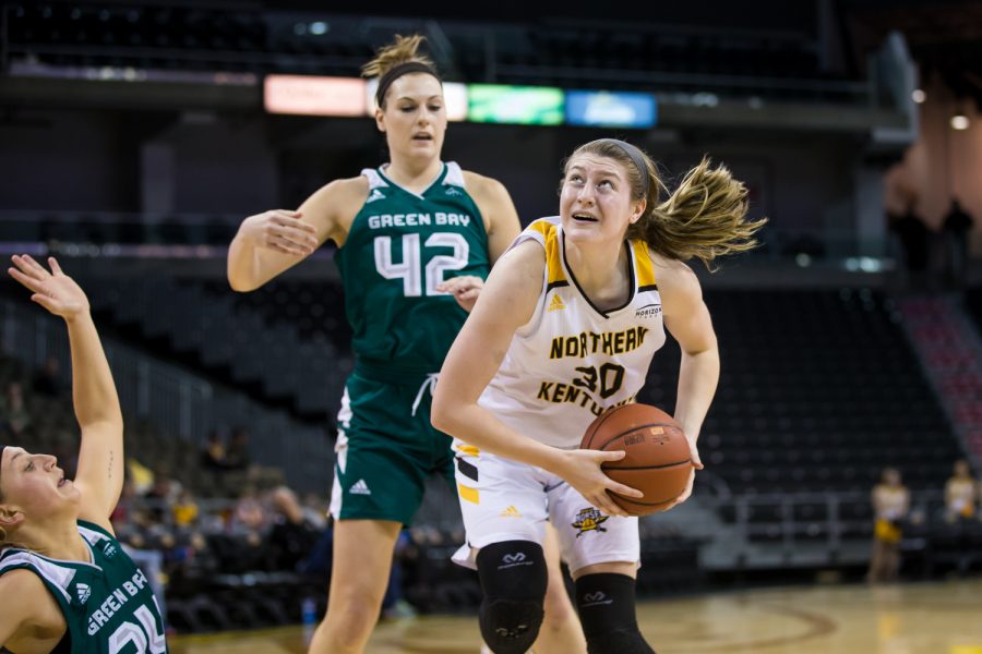 Emmy Souder (30) fights to shoot during the game against Green Bay. Souder shot 2-of-4 from three and had 10 points on the game.