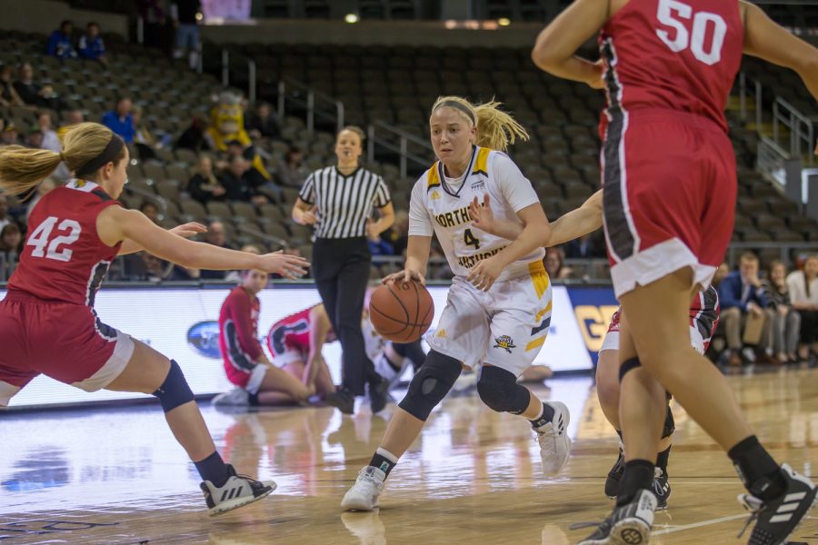 Taylor Clos (4) drives toward the basket during the game against IUPUI. Clos shot 5-of-10 on the night and had 12 points.