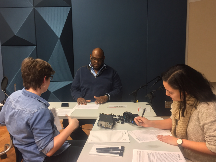 Facilitator Alison Hopkins debriefs two participants for their upcoming interview.