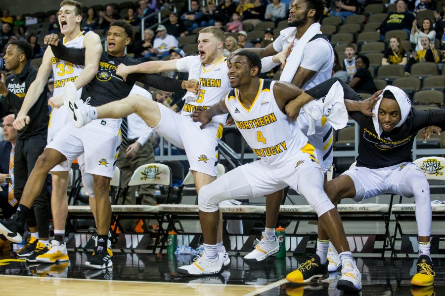 NKU players cheer after a dunk during the game against Detroit Mercy. The Norse defeated Detroit 97-65.