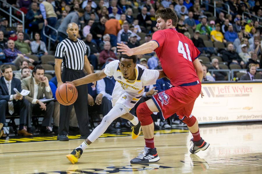 Jalen Tate (11) fights past a Detroit Mercy defender. Tate shot 5-of-11 on the night and had 11 points.