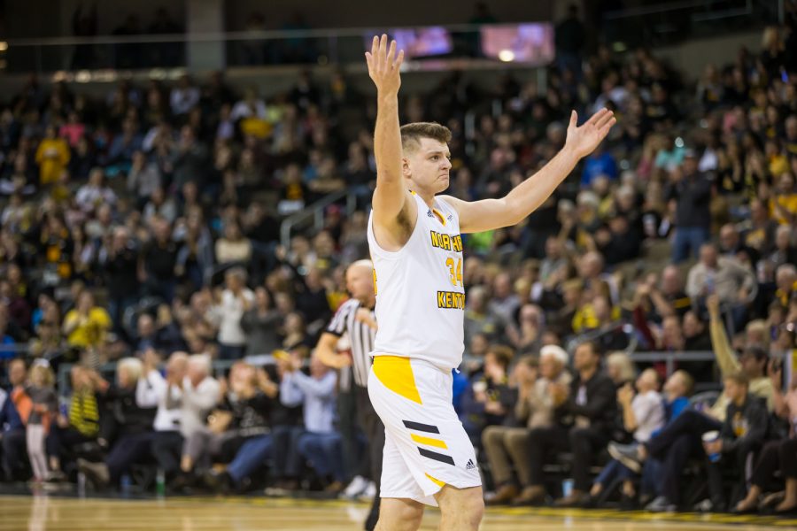 Drew McDonald (34) cheers on the fans before the start of halftime during the homecoming game against Oakland. The Norse defeated Oakland 79-64.