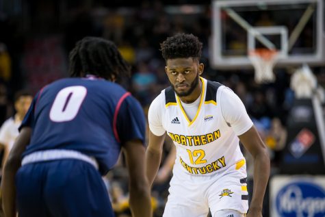 Trevon Faulkner (12) stares down Antoine Davis (0) during the Horizon League Tournament game against Detroit Mercy. Faulkner had 1 steal on the game.