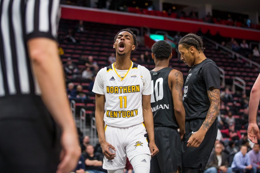 Jalen Tate (11) screams after earning a foul shot off a made basket during the semi-final game of the Horizon League Tournament against Oakland. Tate shot 6-of-18 and was credited with the assist on the game winning three by Drew McDonald (34).