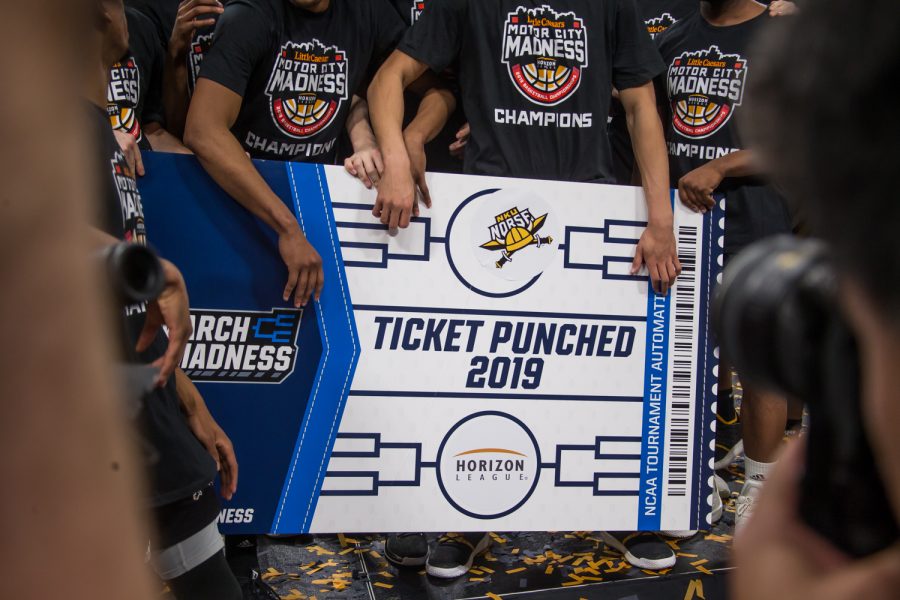 NKU+players+hold+the+sign+showing+their+inclusion+in+the+NCAA+Basketball+Tournament.+NKU+defeated+Wright+State+during+the+final+round+of+the+Horizon+League+Tournament+77-66.