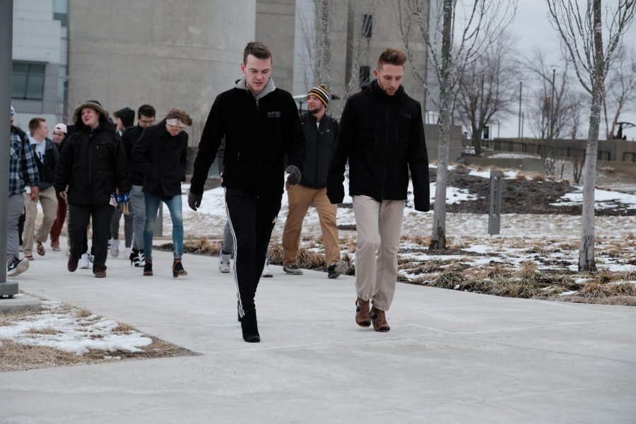Men of NKU "walked a mile in her shoes" to bring an end to power-based violence as part of "StepUp!"