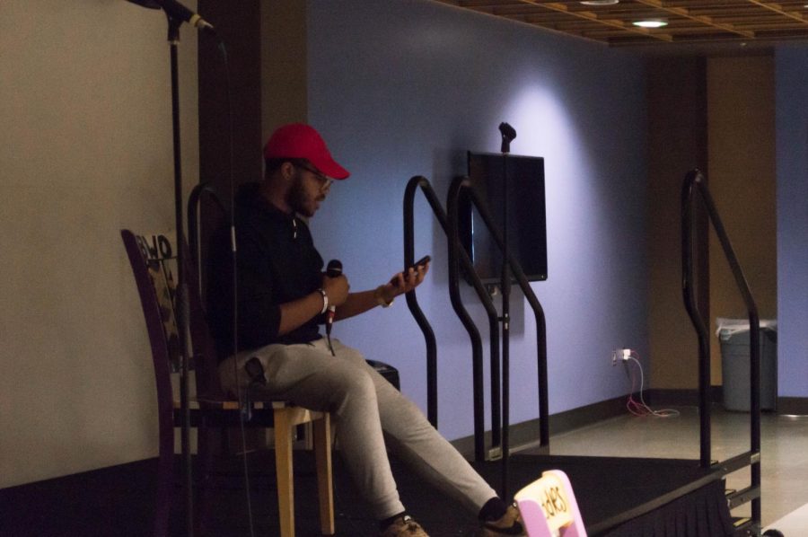 Trey Johnson performing an original piece at Poetic Justices open mic night on Aug. 27.