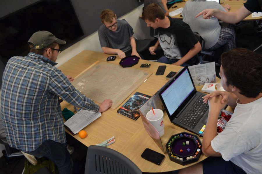 Members of Norse & Dragons play tabletop games in Founders Hall on Fridays.