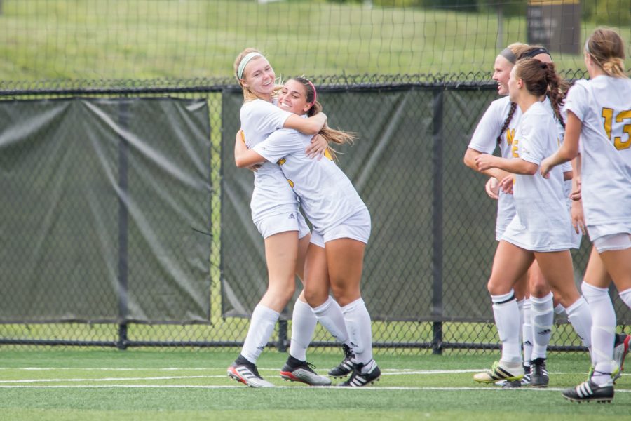 Kailey Ivins (15) celebrates with Kayla Wypasek (23) after her goal during the game against Murray State. Wypasek had 1 goal on the game.