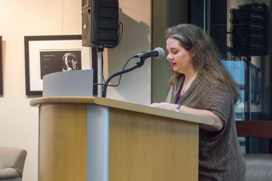 Megan Henson reading her poems from her book 'What Pain Does'