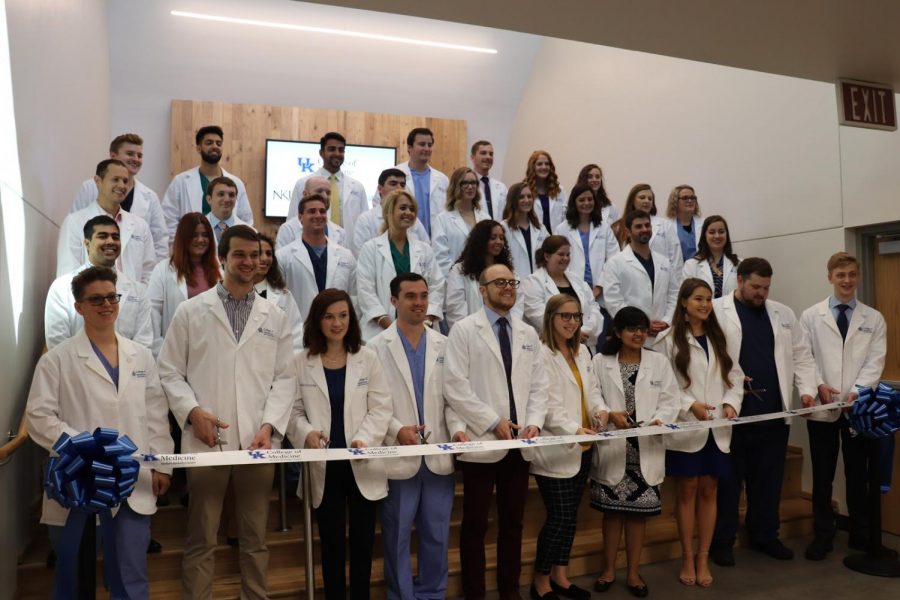 Students of the College of Medicine cutting the ribbon, marking the official opening of the college.