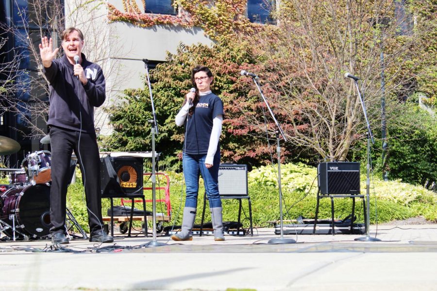 Two faculty members perform a duet.