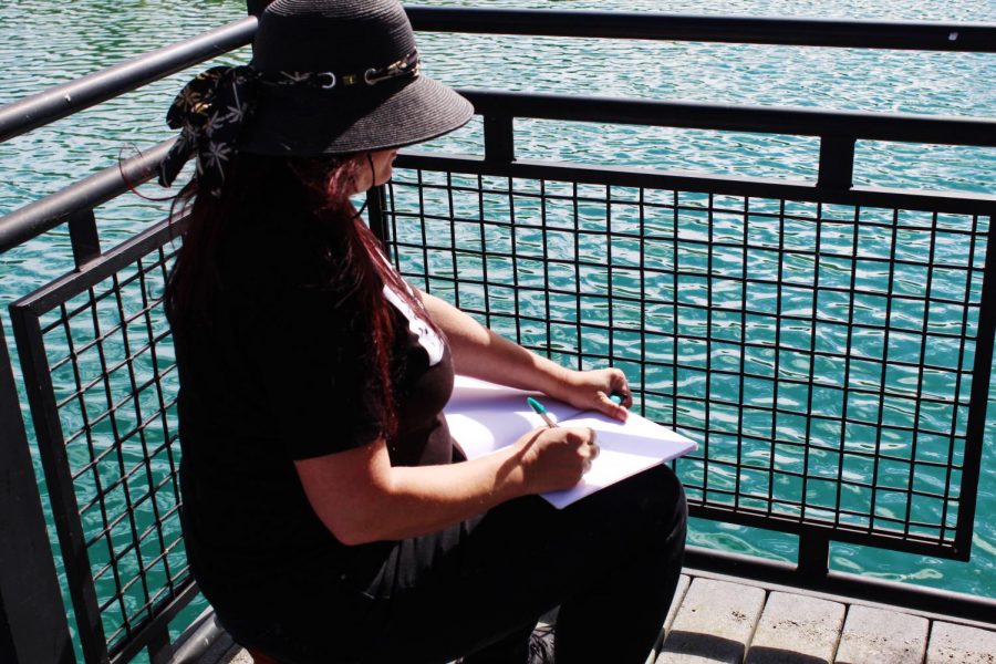 Christina Wald of Urban Sketchers watching the performances across Loch Norse.