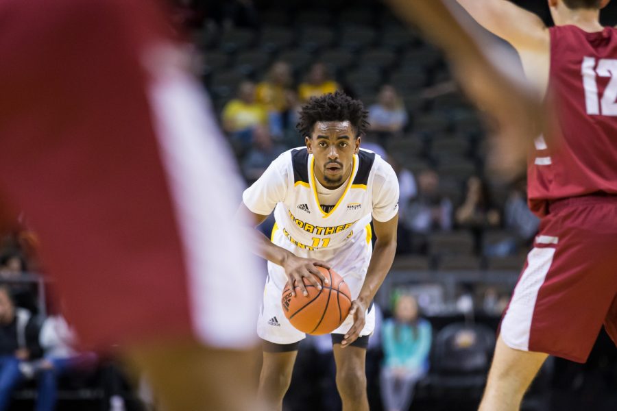 Jalen Tate (11) dribbles looks to pass during the game against Transylvania. The Norse defeated Transylvania 71-45 on the night.