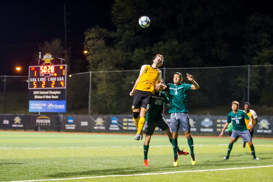 Alex Willis (9) goes up for a head ball during the game against Green Bay. The Norse fell to Green Bay with a final score of 3-2.