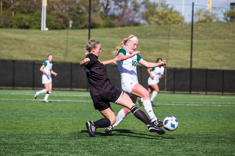 Hannah Fischer (4) defends against a Green Bay player during the game against Green Bay. The Norse defeated Green Bay 5-1 during the game on Sunday afternoon.