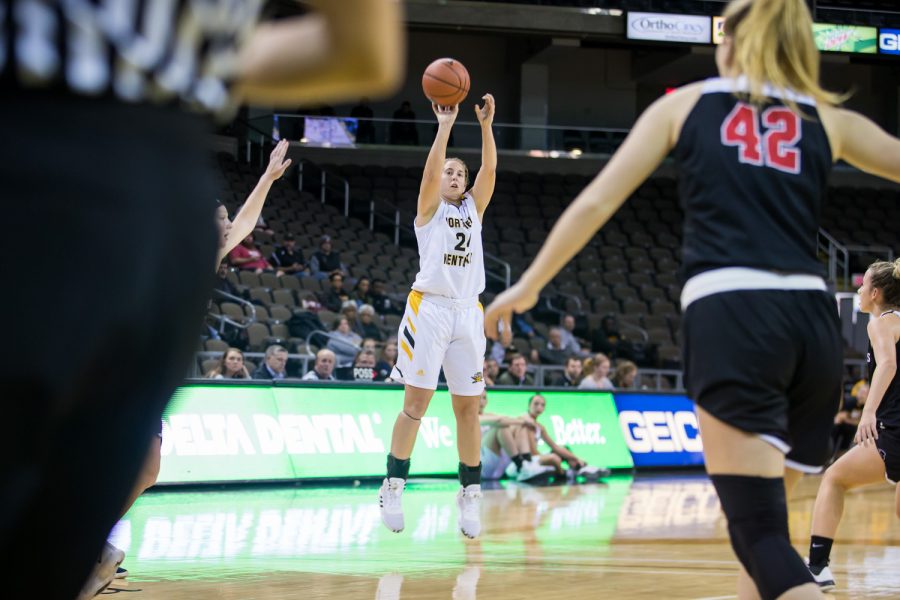 Molly Glick (24) goes up for a three point shot during the game against Davis &amp; Elkins College. Glick shot 5-of-9 on the night and shot 3-of-4 from three.