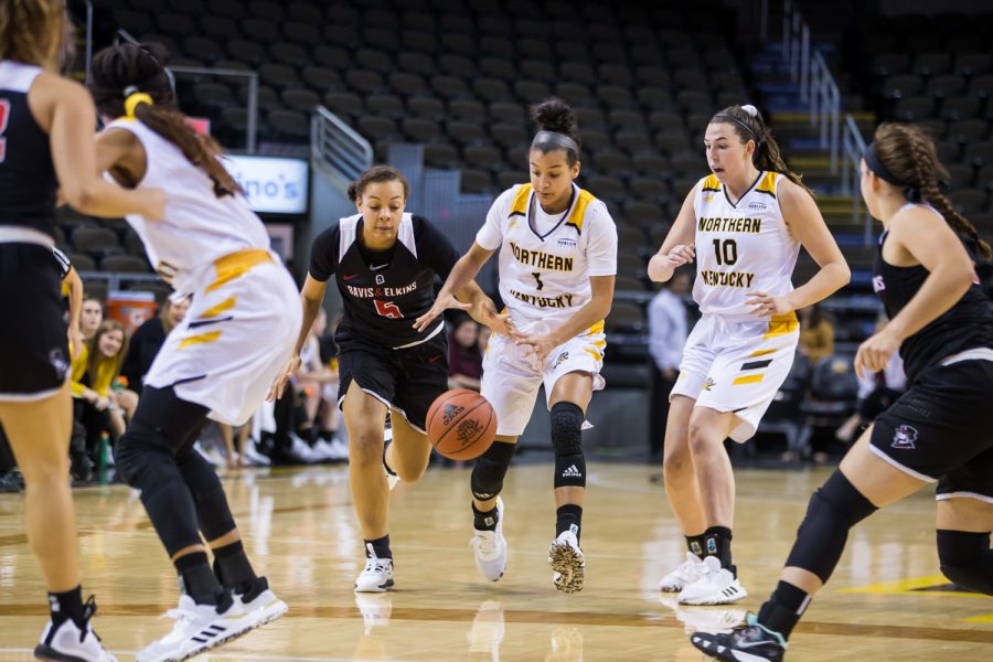 Grace White (1) fights for control of the ball during the game against Davis &amp; Elkins College.  White had 3 points on the game and shot 1-of-5 on the night.