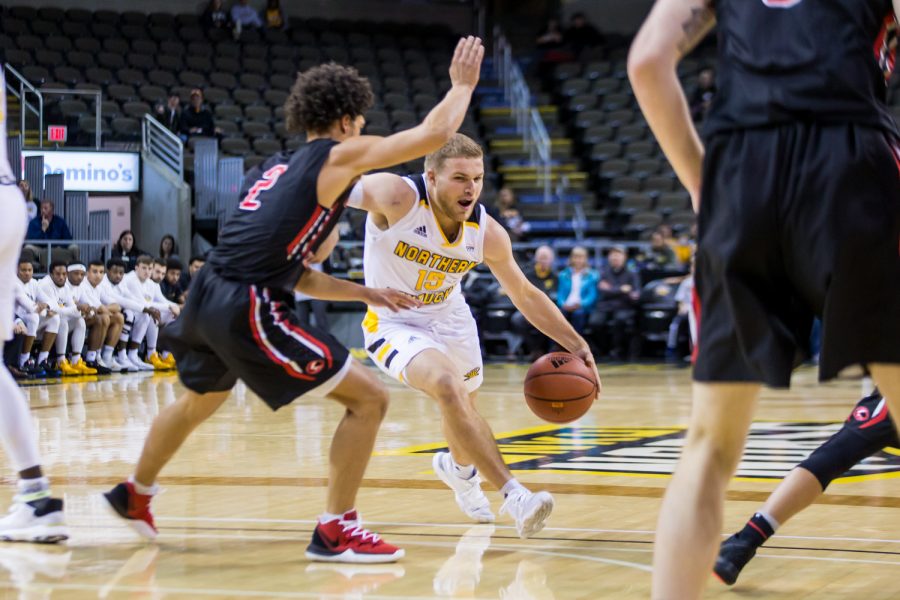 Tyler Sharpe (15) drives toward the basket during the game against UC Clermont. Sharpe shot 7-of-14 from the field and 3-of-9 from three on the night.