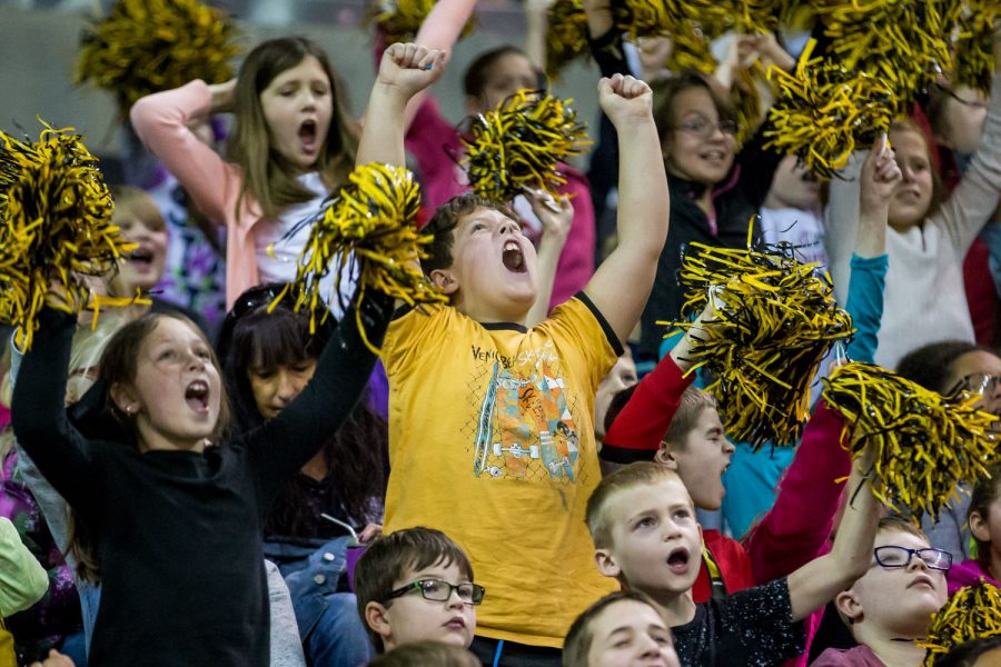 Children cheer during the Victors Hoops 4 Health event held during the Womens Basketball game against the University of Central Arkansas.