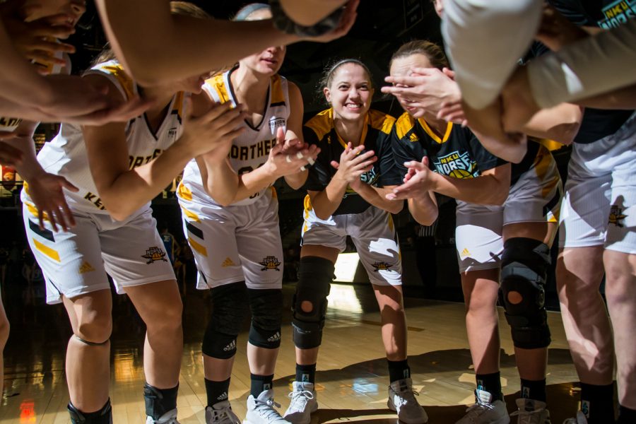 NKU players huddle before the game against Saint Louis University. The Norse fell 67-42 on the night.